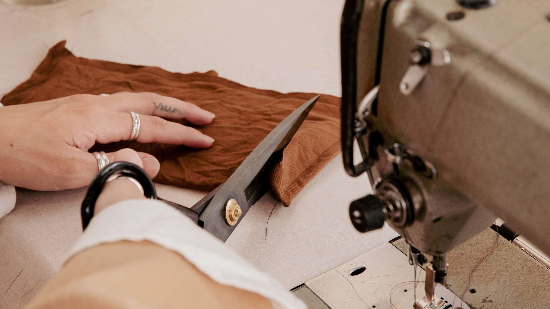 A person cutting fabric